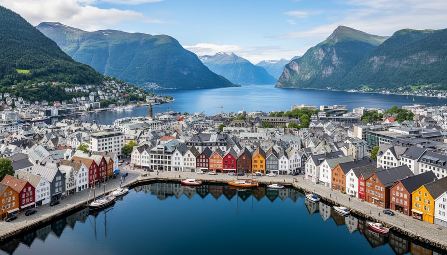 Aerial view of Bergen's colorful historic Bryggen wharf with Norwegian fjords and mountains in background